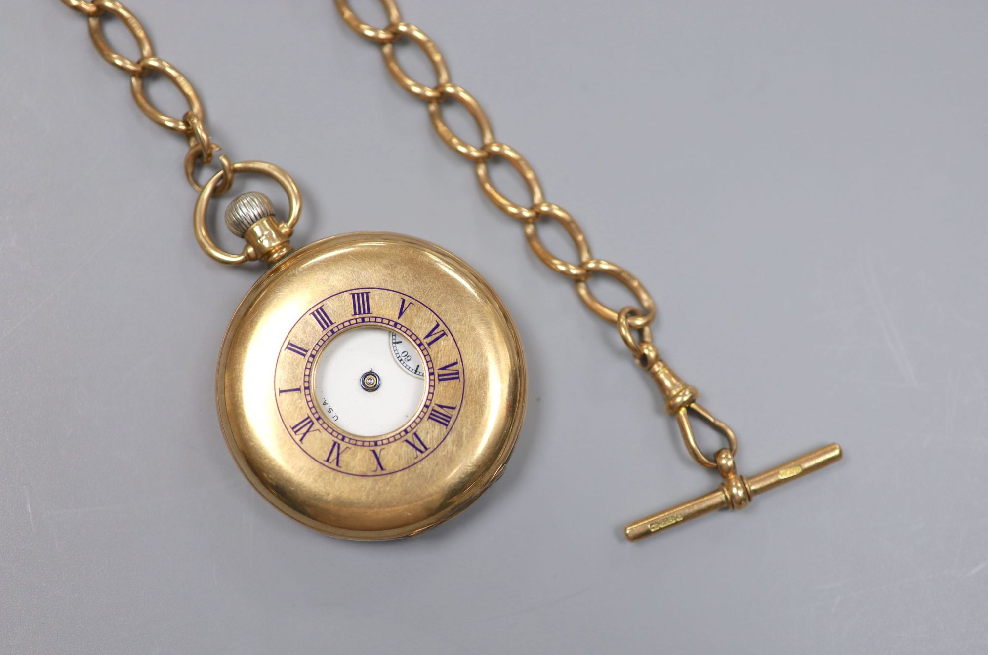 A George V 9ct gold Waltham half hunter pocket watch, with a 9ct gold albert.